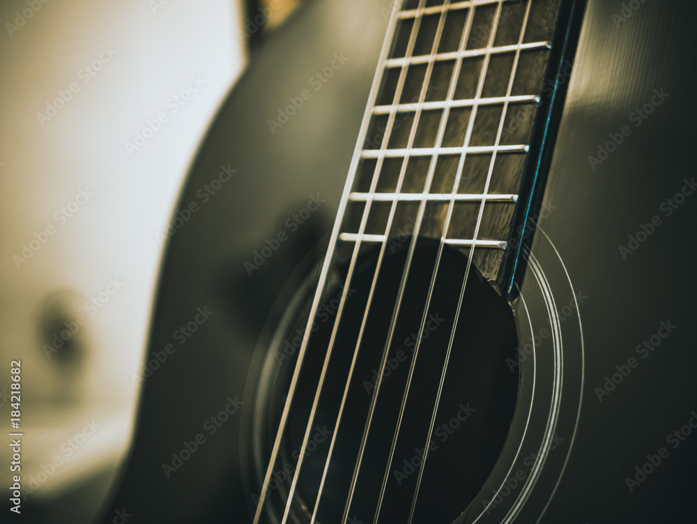 Fototapeta premium macro shot of strings of classical acoustic guitar