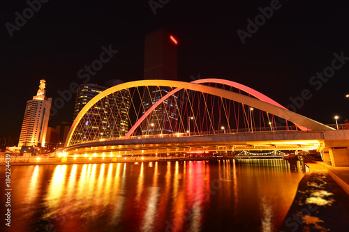 The modern city highway Bridges night landscape car light trails arc in tianjin © qiujusong