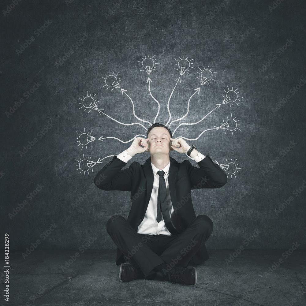 European businessman with bright bulbs over his head European businessman with bright bulbs over his head