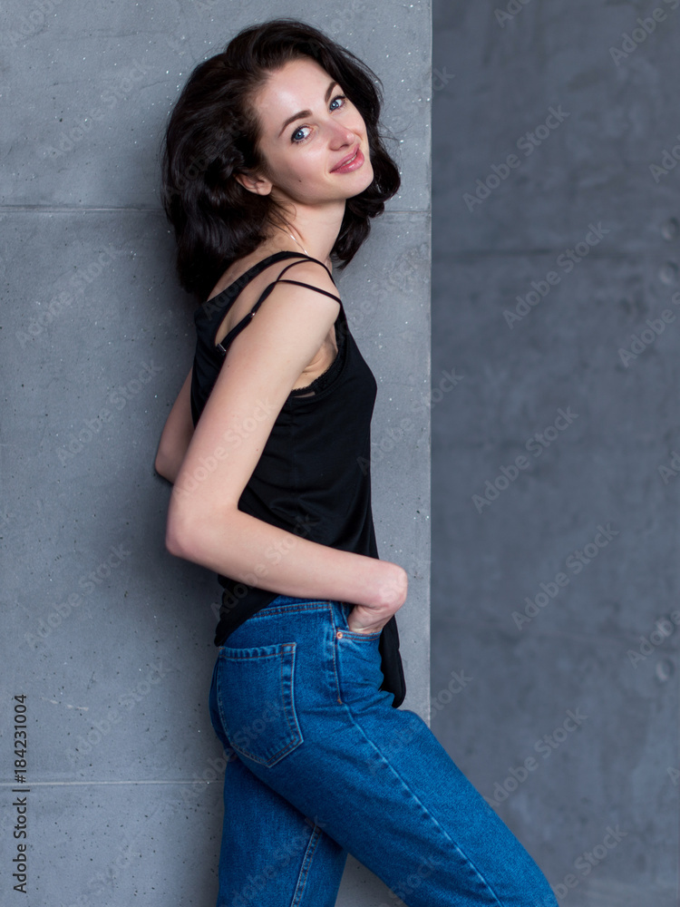 Portrait of slim young Caucasian woman turning back to camera smiling and looking flirty Portrait of slim young Caucasian woman turning back to camera smiling and looking flirty