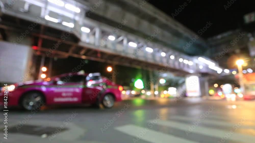Night Traffic time in the Bangkok city. Out of focus with blurry. blur car lights and moving bokeh circles of defocused lights, unfocused city lights. traffic bokeh. Moving Bokeh Circles. Thailand. Night Traffic time in the Bangkok city. Out of focus with blurry. blur car lights and moving bokeh circles of defocused lights, unfocused city lights. traffic bokeh. Moving Bokeh Circles. Thailand.