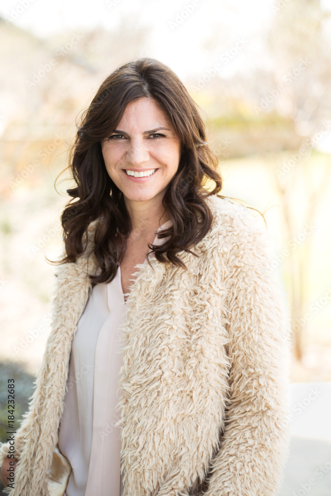 Beautiful middle age woman smiling. Beautiful middle age woman smiling.