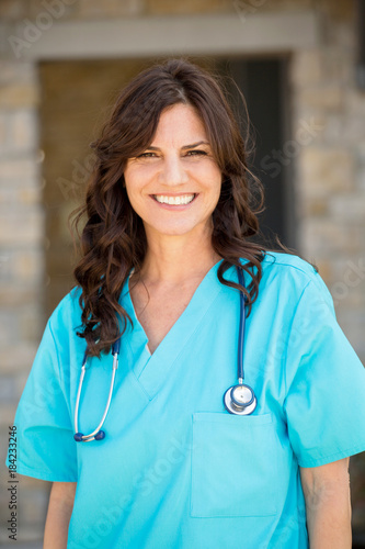 Healthcare worker standing outside the hospital.