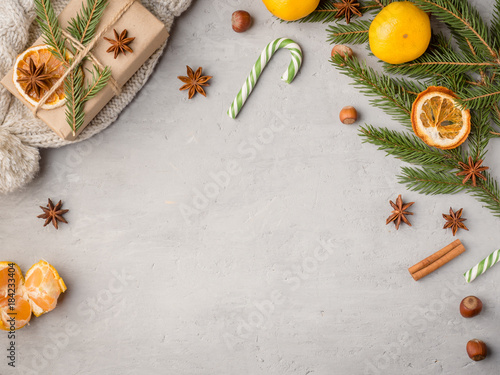 Winter hot chocolate drink in a Cup on a gray concrete background tangerines festive decorations Copy space