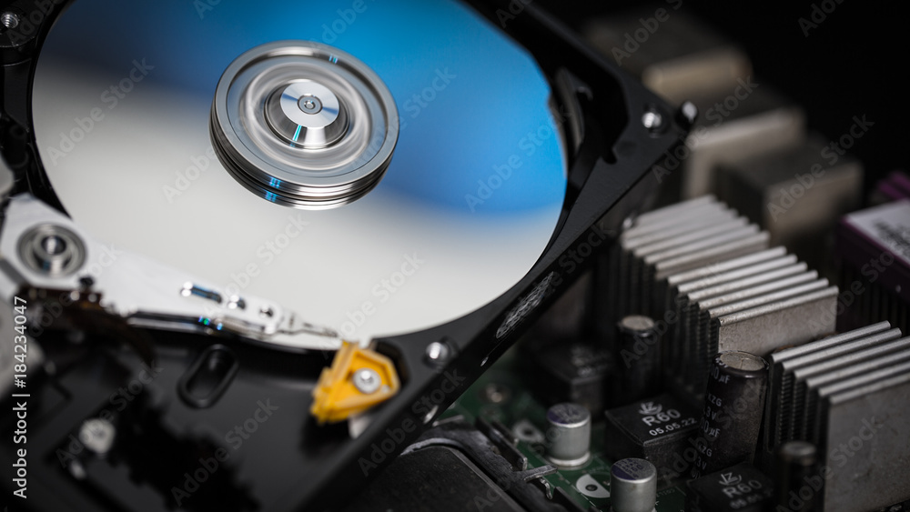 Disassembled hard drive from the computer, hdd with mirror effect Opened hard drive from the computer hdd with mirror effects Part of computer pc. Disassembled hard drive from the computer, hdd with mirror effect Opened hard drive from the computer hdd with mirror effects Part of computer pc.