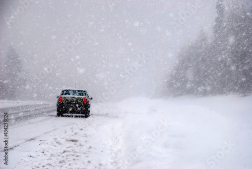 the car in the snow on the track