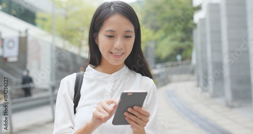 Photography Asian woman use of mobile phone in city