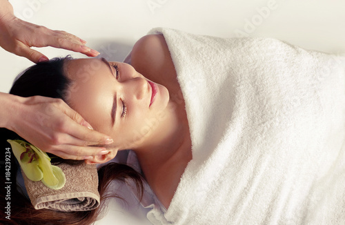 Face Massage. Close-up of a Young Female Getting Spa Treatment.
Woman Skin Care. photo