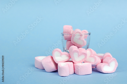 marshmallow heart shape with love concept on blue background