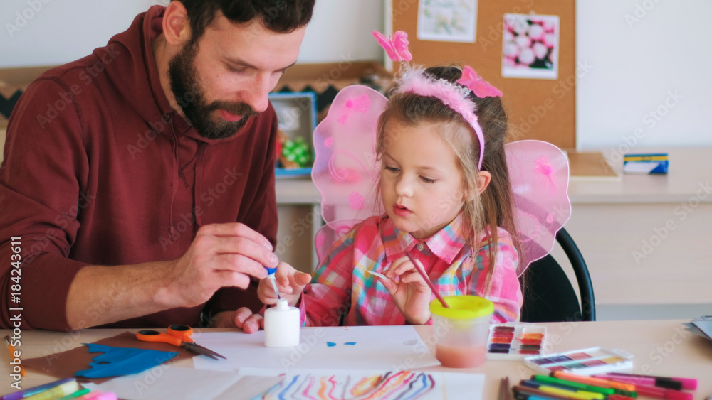 Fototapeta premium father help children art handmade concept. family values. talented little girl. rich imagination.