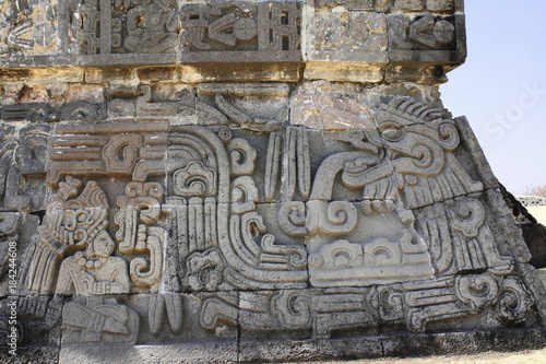 Bas-relief carving with of god Quetzalcoatl, Xochicalco, Mexico photo