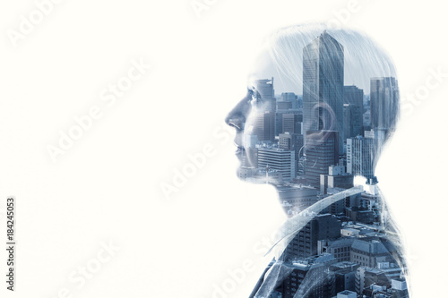 Fotografie Double exposure of businesswoman and cityscape.