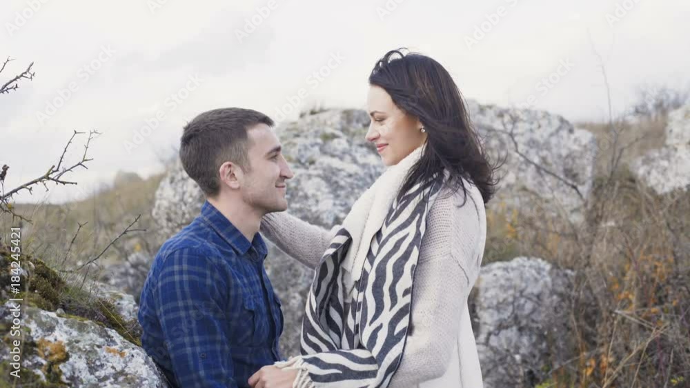 Cute girl comes to her man, embraces and kisses him. 4K Cute girl comes to her man, embraces and kisses him. 4K