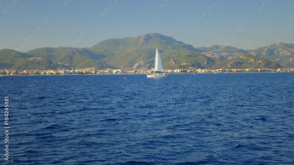 Luxury beautiful yacht in blue sea on mountain background, Mediterranean sea Luxury beautiful yacht in blue sea on mountain background, Mediterranean sea
