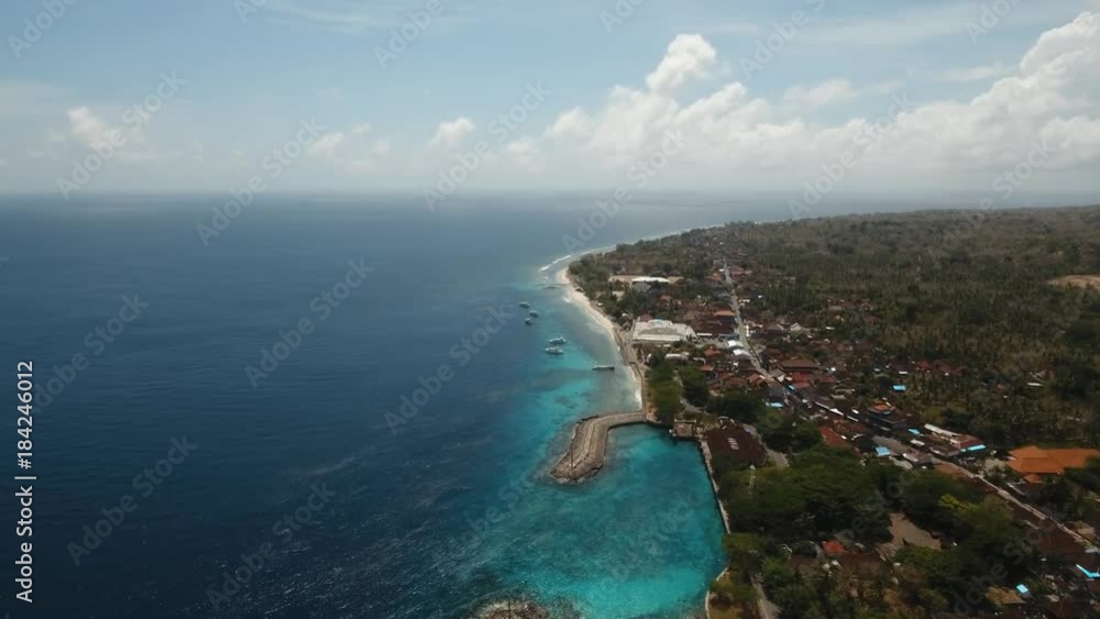 Beautiful tropical beach, palm trees. Aerial view of tropical beach on the island Nusa Penida, Indonesia. Tropical landscape: beach with palm trees. Seascape: Ocean, sky, sea. 4K video. Travel concept Beautiful tropical beach, palm trees. Aerial view of tropical beach on the island Nusa Penida, Indonesia. Tropical landscape: beach with palm trees. Seascape: Ocean, sky, sea. 4K video. Travel concept