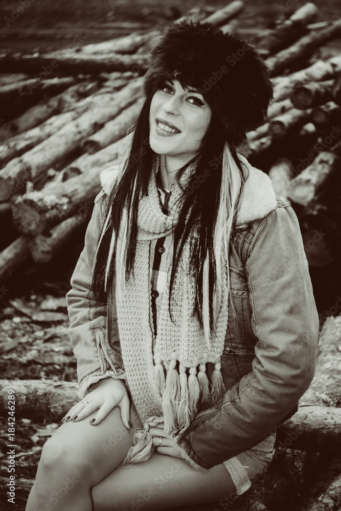 Young people, autumn - winter season and leisure concept - happy woman in winter fur hat outdoors at forest
Young people, autumn - winter season and leisure concept - happy woman in winter fur hat outdoors at forest