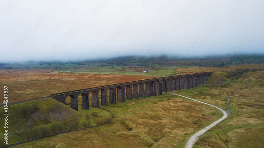 Naklejka premium Aerial View of Train passing over the Ribblehead Viaduct Settle-Carlisle Railway, North Yorkshire