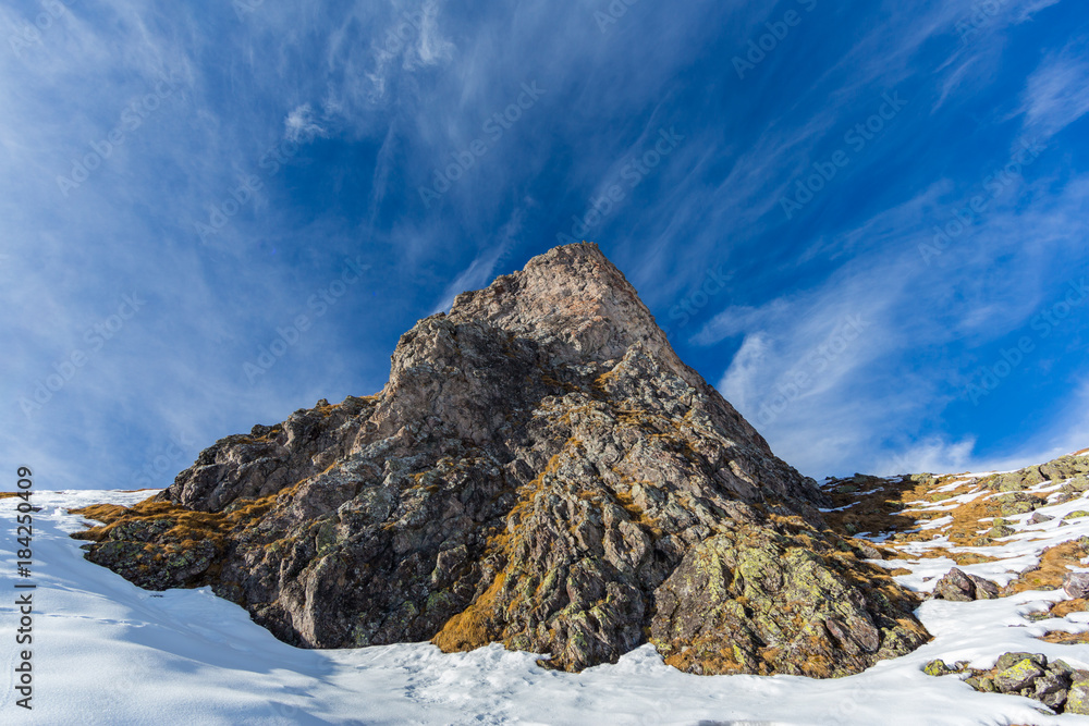 peak of Hörnli mountain in Arosa Switzerland in winter, blue sky
