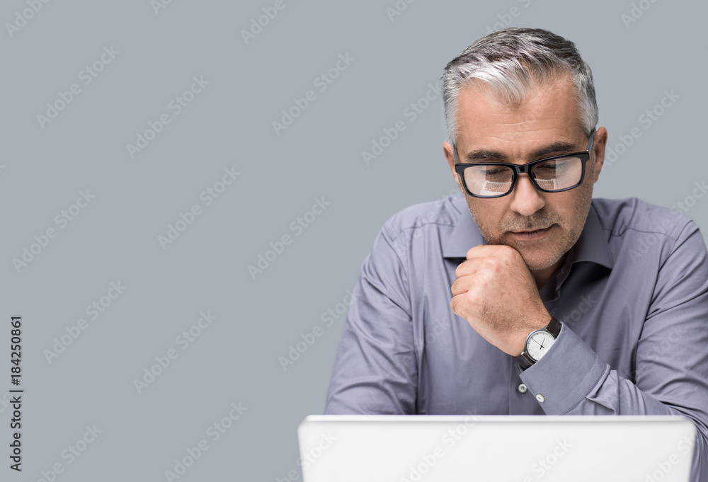 Businessman working with a laptop Businessman working with a laptop