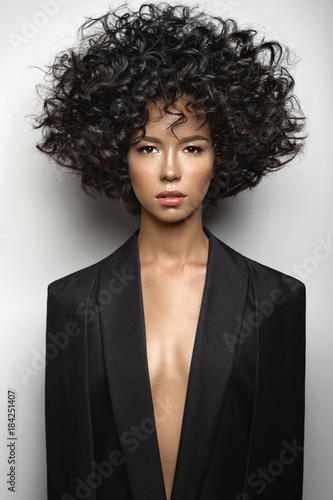 Fotografie Beautiful woman with afro curls hairstyle