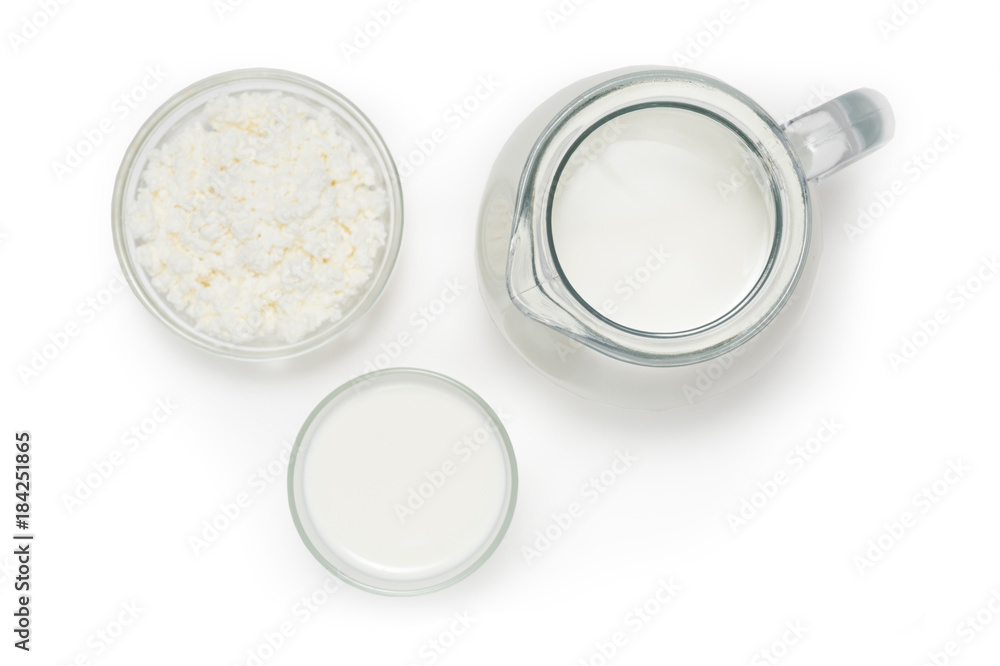 Jug with milk, a glass with yogurt and bowl of cottage cheese on Jug with milk, a glass with yogurt and bowl of cottage cheese on