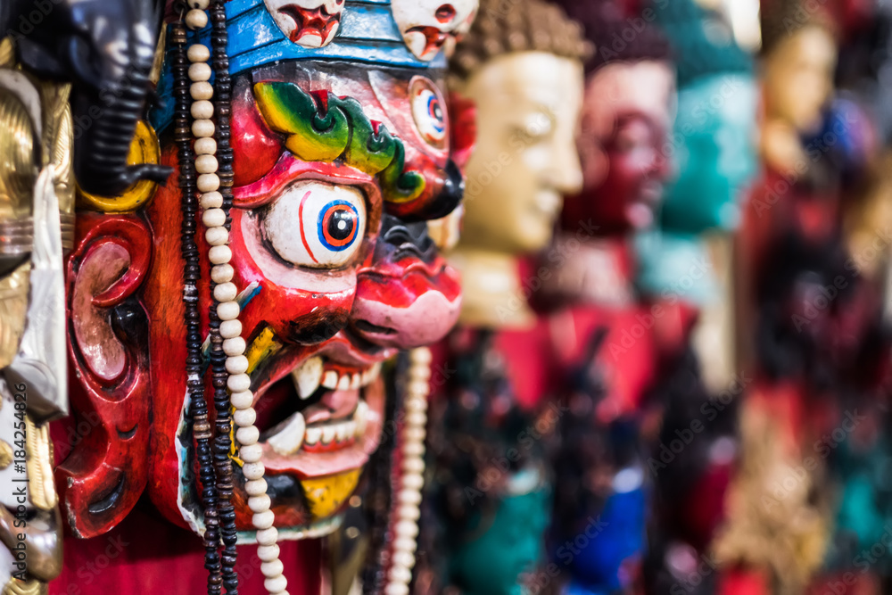 Fototapeta premium Traditional red Bhairav hindu mask hanging at souvenir market