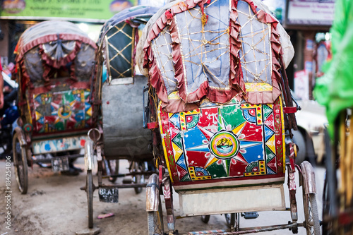 Colorful rickshaw carriage in line on the road, Kathmandu, Nepal. photo