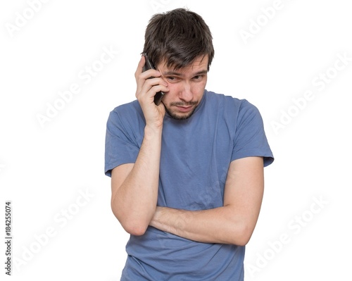 Young man is calling with smartphone. Isolated on white background.