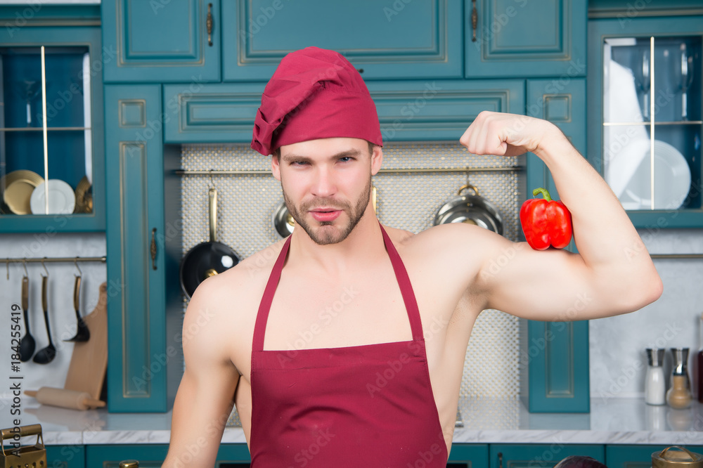 Man in chef hat, apron flex hand muscles with pepper Stock Photo | Adobe  Stock