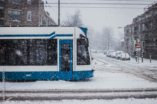 Canvas Print Tram in Amsterdam on snowy day