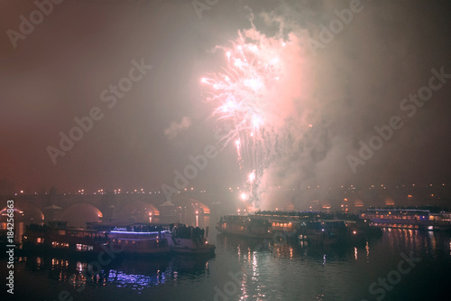 Photography Fireworks on New Year's Eve over ships on the Vltava River in Prague