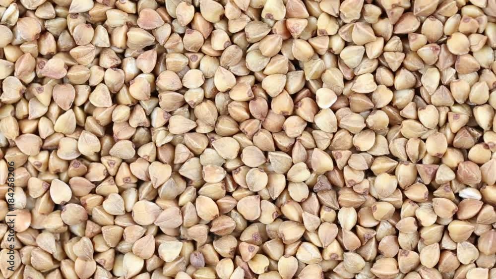 Buckwheat close up. Loop rotation. Front of the camera rotates plate with buckwheat Buckwheat close up. Loop rotation. Front of the camera rotates plate with buckwheat