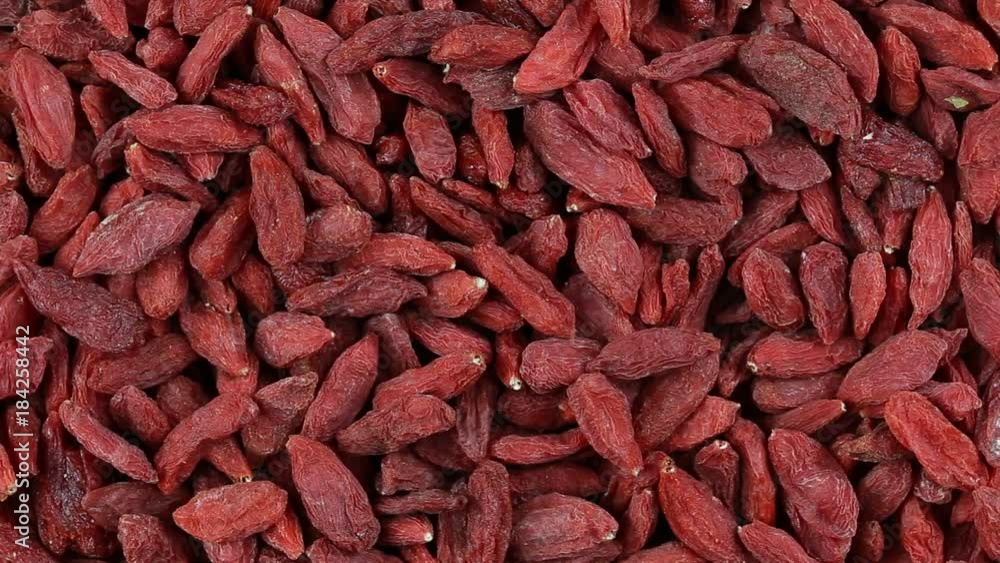 Dried Goji Berries. Loop rotation. Front of the camera rotates plate with bright berries. Close up