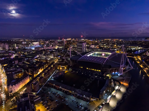 Aerial  view of Cardiff city centre and the bay area at night. photo