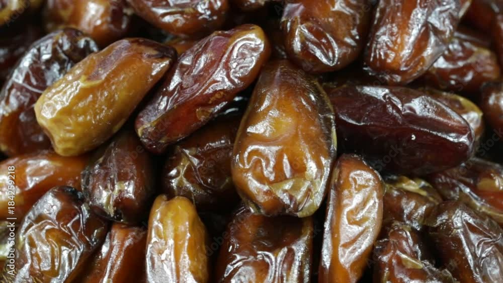 Dried date fruit rotates , close up, macro date fruit background