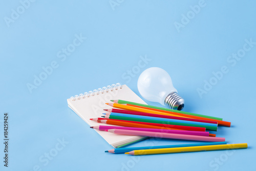 Creative idea for artist, clolour pencils and light bulb photo