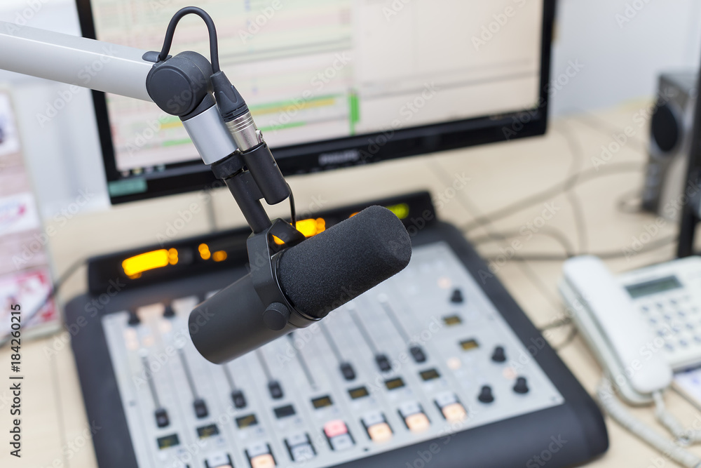 radio microphone on the background of the computer and equalizer closeup radio microphone on the background of the computer and equalizer closeup