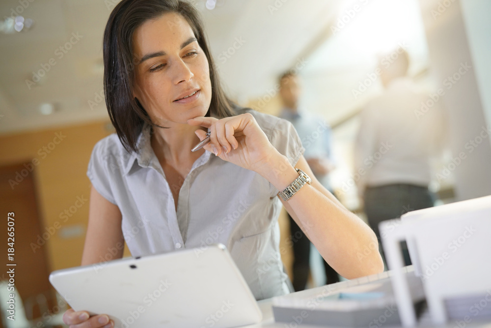 Portrait of businesswoman in office working on digital tablet Portrait of businesswoman in office working on digital tablet