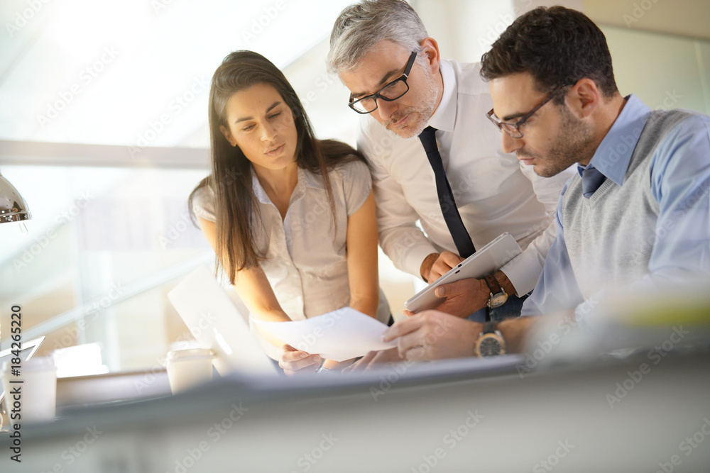 Business team working together on financial project Business team working together on financial project