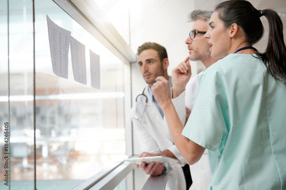 Medical team meeting to talk about medical reports Medical team meeting to talk about medical reports