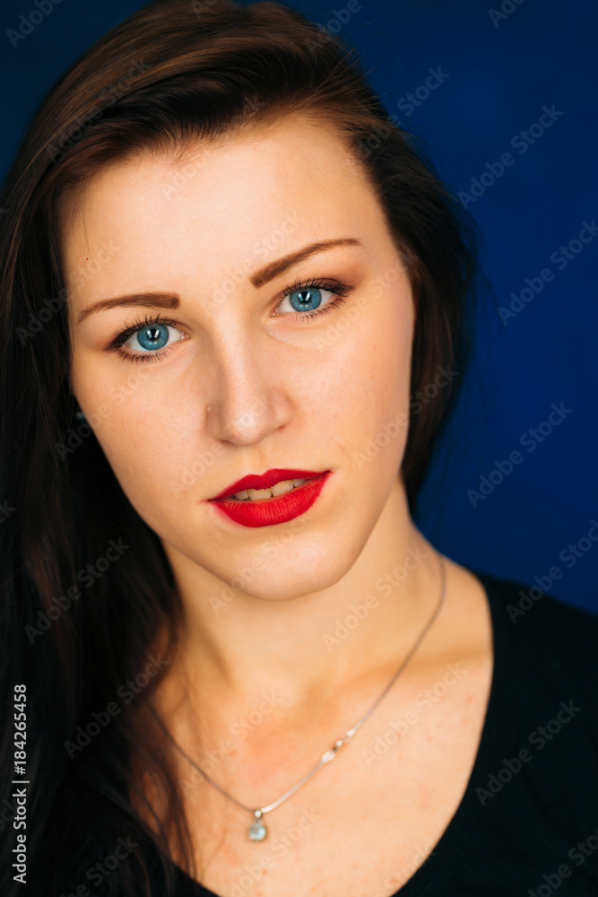 emotional girl smiling on a dark background emotional girl smiling on a dark background