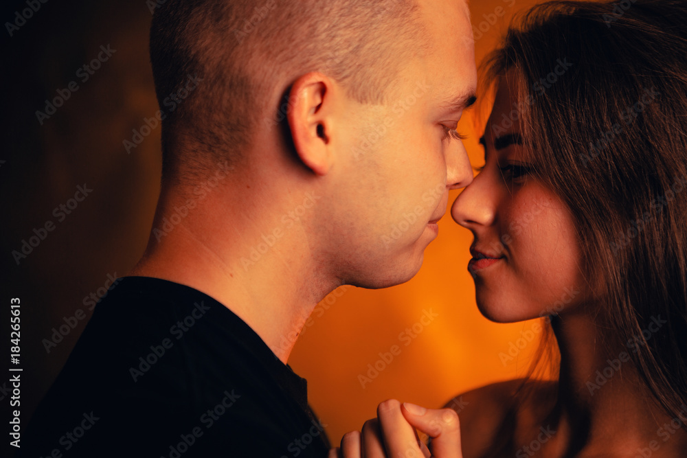Girl and boy on the background of a sunset color Girl and boy on the background of a sunset color