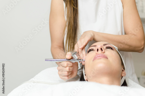 Girl enjoying in oxygen treatment face skin in beauty spa