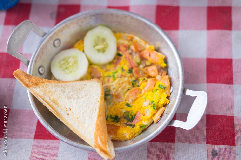 Pan fried egg with toppings is breakfast of Asian food Pan fried egg with toppings is breakfast of Asian food