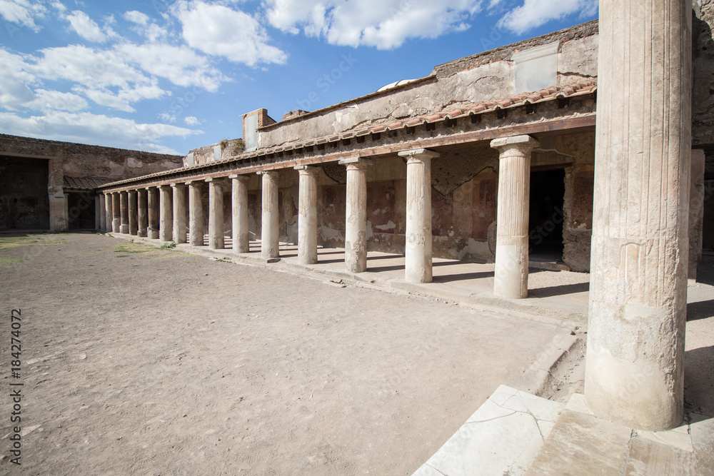 Roman villa courtyard with columns, Pompeii , Naples, italy