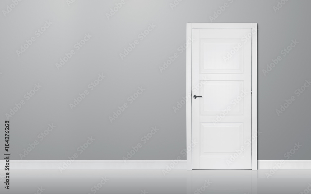 Fototapeta premium Close up of closed wooden door in the empty room with copy space