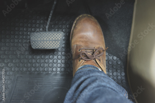 Close up Leather Shoe ob pedal in car