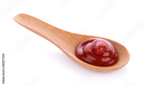 tomato sauce isolated in spoon on white background