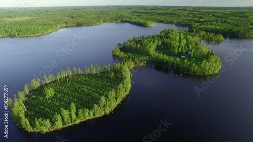 Small farm house in a small scenic cape at a lake in Finland. photo