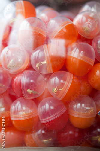 Obraz na płótnie colored capsules with a toy w salonie